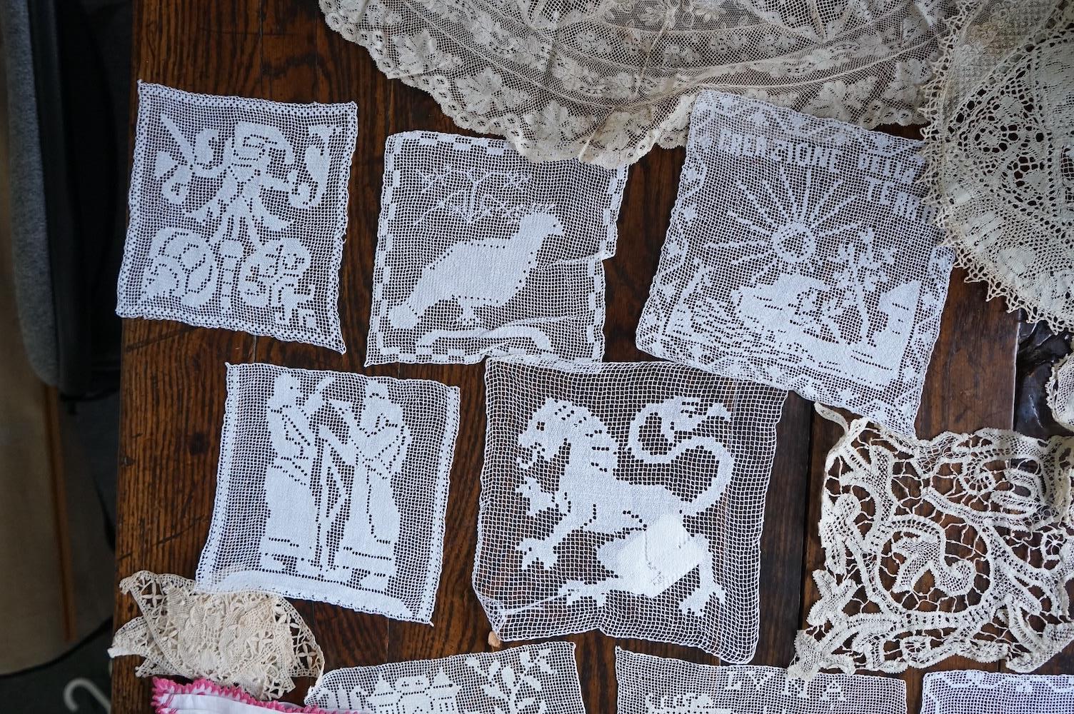 A good collection filet lace including a wide figurative elephant panel, square inserts, mats, trimming etc, with two Normandy lace mats, a cutwork mat and bobbin lace inserts.(40). Fillet panel 112cm long x 27cm wide. C